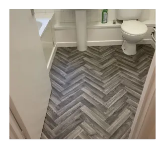 new vinyl bathroom floor with parquet wood effect